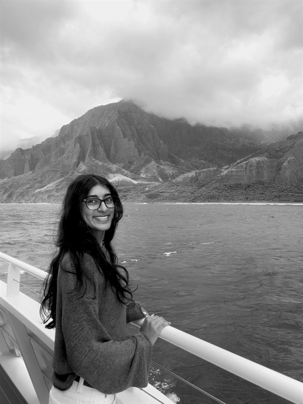Aashvi on boat with mountain background